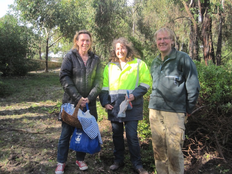 Surf Coast Environmental Officer Leanne Rolfe (centre) and ANGAIR Committee Member Roger Ganley (right) with grateful landowner who made chocolate snowballs for hardworking volunteers.